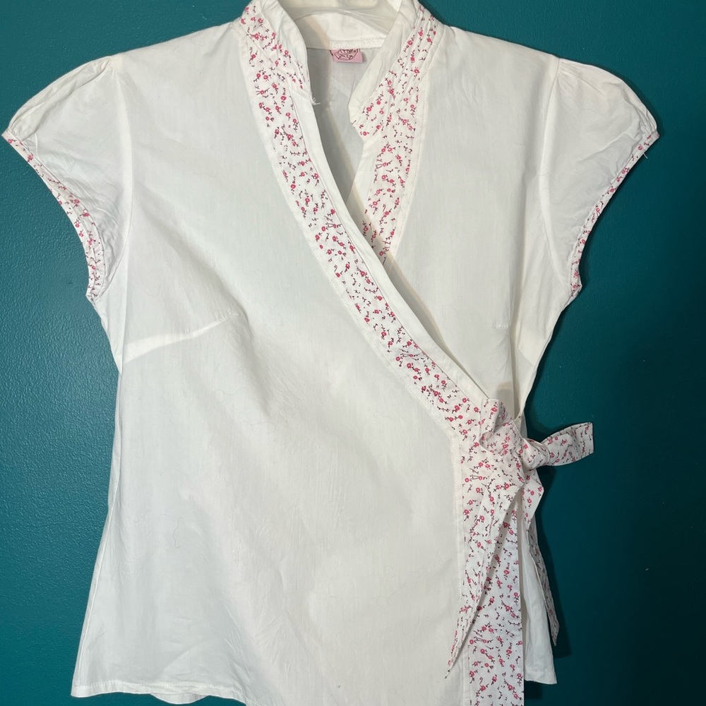 Chic White Wrap Blouse with Pink Floral Trim